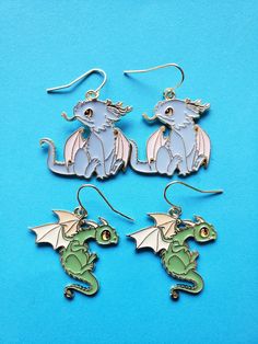 Arent these the cutest pair of green and blue dragons ?!?!?! These enamel earrings are light weight and would make a great gift too! We have other cute earrings as well... Come take a look! https://www.etsy.com/shop/MadeWithAlohaLA?ref=seller-platform-mcnav Whimsical Blue Nickel-free Earrings, Handmade Blue Kawaii Jewelry, Blue Themed Earrings For Gift, Themed Blue Earrings For Gifts, Themed Blue Earrings For Gift, Themed Pierced Earrings As A Gift, Themed Earrings For Pierced Ears As Gift, Themed Gift Earrings, Novelty Blue Drop Earrings