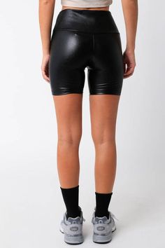 Our Gabrie Pu Biker Shorts features a mid thigh length and a high waisted. Fabric & fit: Model is wearing size Small. Athleisure Shorts For Fall, Trendy Above Knee Bottoms For Night Out, Trendy Above-knee Bottoms For Night Out, Fall Athleisure Shorts, Fitted Elastane Shorts For Night Out, High Waist High Stretch Elastane Shorts, Sporty Stretch Bottoms For Night Out, Stretch Elastane Shorts For Night Out, Fitted Trendy Biker Shorts