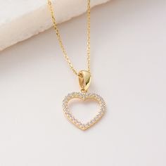 "Shining Channel Heart Pendant, Solid Gold 10K 14K 18K, CZ Simulated Diamond  Necklace, Cubic Zieconia Heart Pendant/Charm Jewelry for everyday wear  Sizes of the *Hexagon Star Heart Pendant* * 0.4inch /  10mm (excluding bail) * 0.6inch /  15mm (including bail) * 100% 10K 14K 18K Solid Yellow Gold (Not Gold Vermail or Not Gold Plated) * Price includes the chain when \"Pendant and Chain option\" is chosen. * Cubic Zirconia clear simulated diamonds * Shining Channel Heart Pendant is a lightweight item. * Polished finish EU and UK taxes; *EU and UK orders over £135/€150 are subject to customs, import duties and tax charges once they reach their destination. This means that the recipient will be responsible for all customs, import duties and sales taxes that may apply at Eu or UK to the purcha Fine Jewelry Yellow Gold Heart Cut Necklace, Fine Yellow Gold Heart Necklace, Fine Yellow Gold Heart Cut Necklace, Gold Plated Heart Necklace Fine Jewelry, Gold Plated Heart Necklace In Fine Jewelry Style, Yellow Gold Heart Cut Birthstone Necklace, Gold Heart Cut Fine Jewelry Necklace, Heart-shaped Yellow Gold Necklace, Gold Heart Cut Necklace