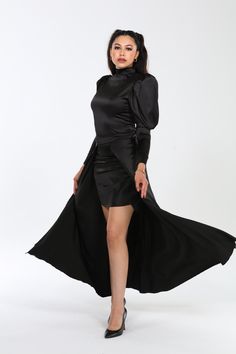 Crafted from a premium blend of 60% polyester, 37% cotton, and 3% spandex, the Genesis dress embodies luxury with its Dolce Satin fabric, offering a smooth, slightly stretchy feel that drapes beautifully and moves with grace. Designed to flatter, its silhouette hugs curves elegantly, enhanced by dramatic puff sleeves and a flowing cape that adds sophistication and movement. Versatile and effortlessly chic, the Genesis dress transitions seamlessly from day to night, whether styled with heels and Dressed Down, Satin Fabric, Puff Sleeves, Formal Event, Best Sellers, Puff Sleeve, Cape, White Dress, Black Dress