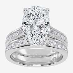 an oval cut diamond ring set with channeled shoulders