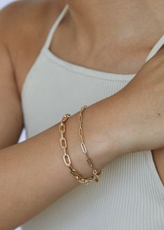 The Paperclip Link Chain Bracelet is essential to your fine jewelry collection. Style with a timeless tennis bracelet or vintage inspired cobra chain. 14k solid gold—always Weight: 1.7g Width: 3mm Lobster clasp closure Luxury Modern Paperclip Bracelet, North Star Necklace, Link Chain Bracelet, Broken Chain, Domed Ring, Yellow Gold Chain, Madewell Jeans, Pearl Charms, Fine Jewelry Collection