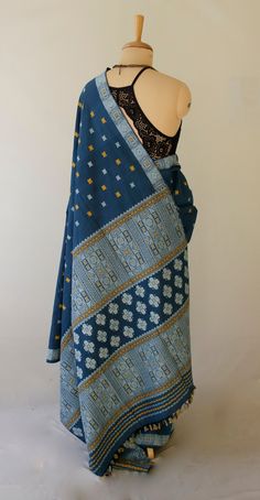 Beautifully woven hundred percent silk saree from our looms in Assam , India . The saree has mulberry silk in the warp and eri silk in the weft and all the interwoven motifs in Eri . All the yarns have been natural dyed using locally available flowers and plants . Since Eri Silk is there, the dress does not have the typical sheen that is associated with Silks from India. Eri Silk is an indigenous Silk variety from India found in Assam and some other North Eastern States. The lack of sheen is typ Bohemian Blue Raw Silk Traditional Wear, Bohemian Handloom Pre-draped Saree, Blue Bohemian Raw Silk Saree, Bohemian Blue Raw Silk Saree, Traditional Blue Cotton Pre-draped Saree, Blue Block Print Tussar Silk Saree, Silk Saree With Block Print In Blue, Blue Silk Saree With Block Print, Blue Block Print Tussar Silk Dupatta