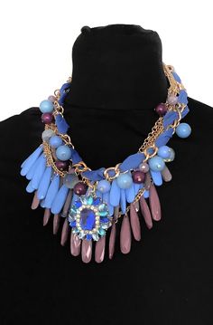 Chunky, blue bead layered statement necklace from Olivia Divine. Multi layered, blue bead and gold tone chain necklace with a blue crystal jewelled centre piece. Adjustable length. Perfect as a gift or treat for yourself. Luxury Multicolor Necklace With Large Beads, Blue Chain Costume Jewelry, Blue Costume Jewelry With Chain, Blue Costume Jewelry Necklace With Chain, Elegant Blue Beaded Necklaces With Chain, Blue Beaded Chain Layered Necklace As Gift, Blue Beaded Chain Layered Necklace For Gift, Blue Jewel Necklaces For Parties, Blue Jeweled Necklaces For Party