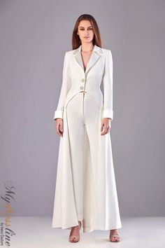 Looking for a chic and unique dress for your next special occasion? Check out the Sara Badr 27341 from the Spring 2021 evening collection. Whether you're attending a black tie event or a family wedding, you'll be sure to turn heads in this stunning dress. White Suit Wedding Women, Female Suit Wedding, White Party Outfits Women, Pantsuit Wedding Dress, Harvey Outfits, All White Party Outfits, White Party Outfit, Exclusive Gowns, Met Gala Outfits