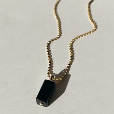 Introducing the Elixir Necklace - this one is for the minimalist girly. She's sophisticated & will add value to your personal style. Some believe that the Onyx stones are associated with love, protection & courage. Others believe that black onyx stones are used to create balance & harmony in the wearer's life. The Elixir Necklace will make you magnetic! Product Details: 18" 14K Gold-Filled Flat Ball Chain 24mm Black Onyx Charm Water-Wearable Made in Scottsdale, AZ Black Onyx Stone, The Minimalist, Solid Gold Jewelry, Scottsdale Az, Onyx Stone, Gold Filled Jewelry, Ball Chain, Black Onyx, Jewelry Care