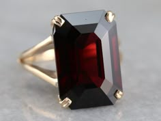 Luxury Garnet Rings With Accent Stones, Formal Garnet Rings Fine Jewelry, Luxury Yellow Gold Rings With Garnet, Luxury Garnet Gemstone Rings, Formal Garnet Ring With Polished Finish, Luxury Garnet Promise Ring, Elegant Polished Ruby Ring For Formal Occasions, Elegant Formal Ruby Ring With Polished Finish, Elegant Formal 14k Gold Ruby Ring