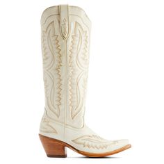 a pair of white cowboy boots with wooden heels on the side and an embroidered design