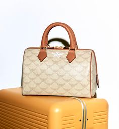 Find MCM Ella Boston Bag on Editorialist. The MCM Ella Boston Bag features a top handle and a monogram pattern. It is a small bag that can be hand carried. A Monogram, Monogram Pattern, Cute Purses, Boston Bag, Small Bag, One Color, Travel Bags, Top Handle, Boston