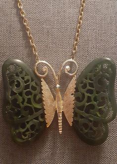 Gold Crown carved open work green acrylic butterfly pendant necklace. Green rhinestone eyes.  chains are 23" and 28" Acrylic Butterfly, Flagstaff Az, Rhinestone Eyes, Butterfly Pendant Necklace, Necklace Green, Flagstaff, Gold Crown, Butterfly Pendant, Gold Gold