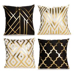 four pillows with gold and black designs on them