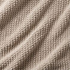 the texture of a knitted blanket is shown