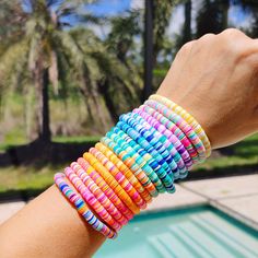 🛒Our preppy, colorful, and bright mixed clay bracelets make the perfect summer (and beyond) accessory! With bright clay heishi beads, you can create unique stacking bracelets to match any outfit. The perfect gift idea for someone special! 📦FREE SHIPPING on orders $35 or more to US shoppers 💎Care = We recommend: -Remove when sleeping -Allow perfumes and lotions to dry before wearing -Roll the bracelet gently on and off your hand instead of overly-stretching the bracelet -Keep away from moisture (although polymer clay itself is water resistant, to extend the life of your jewelry you should avoid wearing in the shower or bath, pool, ocean, or lake, or around water-based chemicals) 🧵Material = 6mm Polymer Clay Heishi Beads, 6mm Gold Metal Bead & Stretch Cord 🎨Color = 17 Mixed Color option Cheap Rainbow Heishi Beaded Bracelets, Clay Beaded Bracelets, Bracelets Preppy, Make Clay Beads, Colorful Preppy, Clay Bracelets, Clay Bead Necklace, Heishi Bracelet, Beaded Braclets