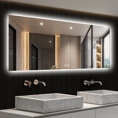 a bathroom with two sinks and a large mirror over it's wall mounted faucet