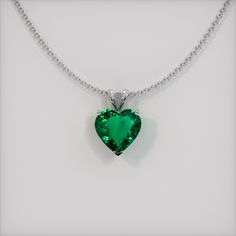 The pendant is entirely set in 18K white gold. The pendant features a beautiful, transparent 1.98 carat heart shape green emerald with the dimensions of 8.97 x 9.23 x 4.36 mm and a mixed brilliant cut. It has a clarity grade of slightly included (evaluated at eye level), vivid color saturation, and an excellent polish. The origin of this emerald is Zambia. #gift necklace #beautiful necklaces #necklace for her #accessories necklaces #necklace cute Luxury Teardrop Pendant Emerald Necklace, Luxury Emerald Necklace With Vvs Clarity As A Gift, Emerald Pendant Necklace Zales, Luxury White Gold Emerald Necklace With Round Pendant, Luxury Emerald Teardrop Pendant Necklace, Luxury Green Emerald Teardrop Pendant Necklace, Luxury Vvs Clarity Emerald Necklace As Gift, Luxury Teardrop Emerald Pendant Necklace, Luxury Emerald Necklace For A Gift