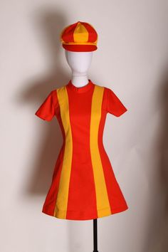 1960's Ketchup Red and Mustard Yellow Striped Mod Burger King Uniform Mini Dress with Matching Hat Uniform by Pretti Careers  This outfit features: *Ketchup red and mustard yellow colors *Striped *Short sleeved *Mini dress *Rear metal zipper *1960's Burger King Womens Uniform *Comes with matching hat  Label: Pretti Careers Size: X-Small  Labeled size 10 on the dress and large on the hat  Measurements: Dress Measurements:  Bust: 33" Waist: 27" Hip: 39" Length: 32 1/2" Hat Measurements: Height: 7 Retro Red Dress For Costume Party, Orange Mod Fitted Dress, Orange Fitted Mod Dress, Fitted Orange Mod Dress, Womens Uniform, Sleeved Mini Dress, Springfield Mo, Matching Hat, Striped Short