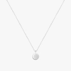 Teeny tiny round disc dangles on a delicate chain choker. Beautiful Minimalist daily wear. Material 14K Gold Filled or 925 Sterling Silver. Nickel free. Suitable for Sensitive Skin. Quantity & Measurement One tiny disc choker Adjustable Length: 12 + 3 inches extension Pendant size: 6mm Silver : 925 Sterling Silver Gold: 14 Karat Gold Filled Handmade with ♥ Simple Round Disc Necklace With Delicate Chain, Minimalist Charm Necklaces With Round Pendant, Sterling Silver Charm Necklace With Round Disc, Minimalist Charm Necklace With Delicate Chain And Round Pendant, Minimalist Charm Necklace With Round Pendant And Adjustable Chain, Minimalist Everyday Coin Necklace With Round Pendant, Simple Sterling Silver Round Disc Necklace, Minimalist Circle Sterling Silver Charm Necklace, Minimalist Round Clavicle Chain Charm Necklace