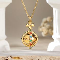 The pendant features a delicate circular frame adorned with an array of vibrant colored stones. At its heart lies a captivating surprise – a dice that gracefully rotates 360°, symbolizing the unpredictability of life's adventures. This unique piece not only reflects your sophisticated taste. Adorn yourself with this exquisite necklace, and let the world witness your flair for both beauty and whimsy.Carat Weight: 0.994 ctStone Size: 1.5,1.6,1.8,2,1.5,1.5 mmNumber of Stones: 73 Stone Color: Garnet Gold Multi-stone Spiritual Necklace, Gold Multi-stone Necklace With Spiritual Style, Gold Spiritual Necklace With Multi-stone, Spiritual Gold Necklace With Multi-stone Details, Luxury Multicolor Birthstone Jewelry, Luxury Multi-stone Round Pendant Jewelry, Gold Multi-stone Round Pendant Jewelry, Multi-stone Round Jewelry Gift, Luxury Multicolor Jewelry For Gift