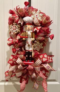 a nutcracker wreath is hanging on the front door