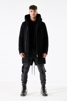 Hooded coat in black moleskin with padded lining.Gunmetal hardware, two side pockets & inside pocket.Made in London, England.Model is 6'0 and wearing size L. Black Hooded Coat, Long Coat Men, Fishtail Parka, Long Overcoat, Long Trousers, Parka Jacket, Hooded Coat, Black Skinnies, Long Sweaters