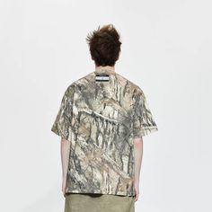 The Forest Camo Pocket T-Shirt seamlessly blends military style with casual comfort. This tee features an all-over woodland camo print, providing a rugged and trendy look. The left chest pocket adds a functional and stylish element, while the drop shoulder design enhances the relaxed fit. A brand logo is sewn just below the back neckline, adding a touch of authenticity. Crafted from premium 100% cotton fabric, this slightly oversized t-shirt ensures both durability and comfort, making it a perfect addition to any casual wardrobe. All-over woodland camo print Left chest pocket Drop shoulder design Brand logo sewn below back neckline Premium 100% cotton fabric Slightly oversized fit Composition: 100% Cotton Brand： LIFEGOESON Wearing: Male model is 185 cm / 6’ 1’’ | 65 kg / 143 lbs wearing si Casual Camouflage T-shirt Relaxed Fit, Relaxed Fit Camouflage T-shirt With Graphic Print, Casual Khaki T-shirt For Outdoor, Casual Camouflage Short Sleeve T-shirt, Military Style Short Sleeve Tops For Outdoor, Military Style Short Sleeve Outdoor Tops, Casual Camouflage Relaxed Fit T-shirt, Outdoor Camouflage Cotton T-shirt, Camouflage Cotton Short Sleeve T-shirt