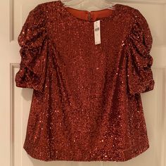 Beautiful Sequin Blouse, One Button Closure In Back At Neck. New With Tags. Beautiful Puff Sleeve That Drape. Size 2, But Roomy For The Size. Perfect For Holidays!! Glamorous Red Blouse, Fall Evening Top With Puff Sleeves, Fall Party Padded Blouse Top, Evening Puff Sleeve Tops For Fall, Puff Sleeve Padded Blouse For Evening, Chic Short Sleeve Blouse For Party Season, Padded Blouse For Fall Party, Fall Sequined Short Sleeve Blouse, Fall Sequin Short Sleeve Blouse