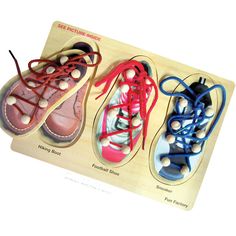 three pairs of shoes are shown on a wooden board with stringing around the soles