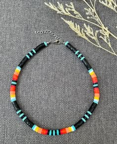 This necklace is handmade to last, with a nice colorful pattern, perfect for the summer ( or any time of the year, really)! This choker necklace gives bohemian-style vibes to your look. Each boho-style necklace was created with 6mm clay polymer discs, stainless steel-look lobster clasp, and 2 inch extender chain. I'm offering this necklace in seven different lengths. If you are interested in a different length or colors, please message me! My business thrives on Customer Satisfaction Please do not hesitate to reach me in case there is something wrong with your purchase. I will try my best to make it right for you. Thank you for shopping JGBestBeadedJewelry! Cheap Heishi Beads Necklace For Vacation, Diy Clay Bead Necklace, Adjustable Heishi Beads Choker For Beach, Multicolor Heishi Beads Choker For Beach, Festival Handmade Heishi Beads Choker, Clay Bead Choker Ideas, Bohemian Heishi Beads Choker For Beach, Bohemian Multicolor Heishi Beads Choker, Clay Bead Necklace Ideas