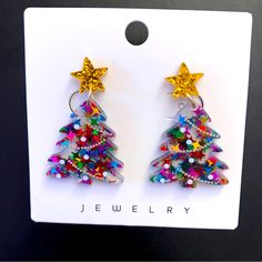 Christmas-Holiday Green Red Blue- Multi Color With Gold Star Top Tree Post Dangle Earrings! Sparkly, Fun Glittery Shiny Earrings! Perfect For The Holidays To Wear Or Give As A Gift! Lightweight. Nwot! Measurements Approximate: 1.75” Length 1” Width Smoke Free Home! Multicolor Christmas Earrings, Christmas Star-shaped Jewelry For Parties, Christmas Party Star-shaped Jewelry, Christmas Star-shaped Party Jewelry, Shiny Earrings, Star Tree, Star Top, Resin Earrings, Gold Star