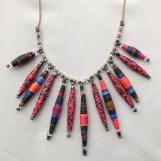 a necklace made out of different colored beads