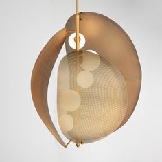 a modern light fixture hanging from the ceiling