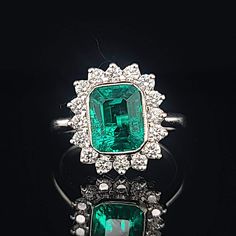 Gorgeous 14K WHITE GOLD ring Gem GREEN Colombia emerald. Center set Gem lab flux growth green Colombia emerald in emerald shape weight 1.75ct. size 8.5x7mm very nice rich vivid green color nice luster, lively ,nice cut,Sparkly emerald. side set 16 natural round diamonds total weight 0.64ct. H-VS Ring size 7.5 Retail Value $6,500 net Appraisal available White Gold Cluster Ring With Emerald Cut Gemstone, Emerald Cut Gemstones With Halo Setting, White Gold Gemstone With Emerald Brilliant Cut, Emerald Cut Green Gemstone Cluster Ring, Formal Emerald Gemstones With Halo Setting, Green Brilliant Cut Ring, Emerald Cluster Ring With Brilliant Cut, Green Emerald Cut Gemstone Cluster Ring, Dazzling Green Emerald Cut Emerald Ring