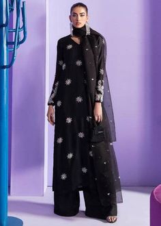 Black silk long kameez has beautiful beads and sequin embroidery motifs over the front and full embroidered sleeves with Palazzo pant with matching embellished orgenza dupatta  ✨This dress can be customise in any other colour and in all size. ✨We use high quality fabric and threads for embroidery.You won't face any problem in future regarding fading of colour or anything. ✨There may be slight colour difference due to high camera resolution and other filters. Care Instructions Dry clean only Silk Anarkali Set With Dabka Work And Long Sleeves, Diwali Embellished Semi-stitched Lawn Suit, Designer Long Sleeve Georgette Salwar Kameez, Semi-stitched Embellished Anarkali Kurta, Black Embellished Palazzo Set For Eid, Embellished Semi-stitched Palazzo Set For Eid, Embellished Chanderi Palazzo Set With Straight Kurta, Anarkali Embellished Palazzo Set For Eid, Embellished Anarkali Palazzo Set For Eid