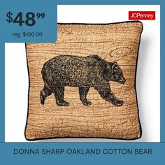 a pillow with a bear on it and the price is $ 48 99 reg $ 100 00