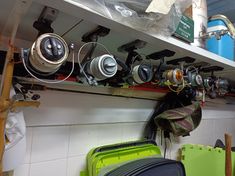 there are many different types of fishing reels on the shelf