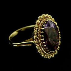 Amethyst Ring Victorian Style Cocktail Large Oval Amethyst Yellow Gold Bezel Set Gemstone Color Stone Classic twisted wire work around an oval amethyst (approx. 7.40cttw 16 x 12 mm), set with a gallery of prongs. This beautiful ring is made of 14k yellow gold and is available in all sizes, please contact us for your size preference. Ring Dimension: Top Height: 23 mm Width: 18 mm Center stone is set above the finger approx. 9mm PROUDLY MADE FROM SCRATCH IN NEW YORK CITY. SKU: R2166MA Our Pledge: Fine Jewelry Oval Birthstone Ring, Wedding Amethyst Ring In Polished Yellow Gold, Wedding Amethyst Ring With Polished Yellow Gold Finish, Heirloom Oval Amethyst Ring For Formal Occasions, Oval Amethyst Diamond Ring In Yellow Gold, Wedding Yellow Gold Amethyst Ring With Polished Finish, Fine Amethyst Rings For Formal Occasions, Yellow Gold Amethyst Oval Ring, Oval Amethyst Ring For Formal Occasions