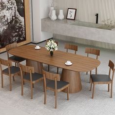 a dining room table with chairs around it