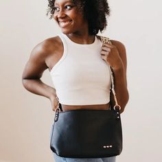 Make a statement with the Cora Structured Hobo Bag! This structured hobo-style bag features a guitar strap and snap closure for easy access, plus two handy zippers (one on the outside, one on the inside) for extra security. It also includes a small cloth pocket inside, so you can keep your goodies safe and organized. And with its flexible body, you can dress it up or down for any occasion! Versatile Shoulder Bag With Snap Closure For On-the-go, Chic Crossbody Shoulder Bag With Hardware, Everyday Hobo Shoulder Bag With Metal Hardware, On-the-go Hobo Bag With Metal Hardware, Everyday Use Crossbody Hobo Bag With Zipper Closure, Modern Hobo Bag With Snap Closure For Daily Use, Chic Satchel Shoulder Bag With Hardware, Everyday Crossbody Hobo Bag With Zipper Closure, Everyday Crossbody Hobo Bag With Zipper