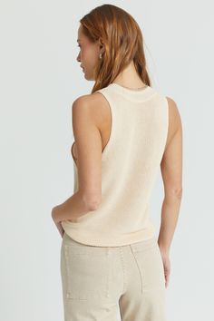 Our ribbed knit sleeveless top is the essential warm weather top. It's airy and shows just enough shoulder for a cool summer look. Sleeveless Textured Knit Tank Top For Layering, Textured Knit Sleeveless Tank Top For Layering, Chic Cotton Tank Top With Ribbed Neckline, Chic Knit Tank Top For Day Out, Trendy Tank Sweater Vest For Summer, Summer Textured Knit Tank Top For Layering, Summer Layering Pointelle Knit Sweater Vest, Chic Tank Knit Top For Day Out, Trendy Cotton Knit Tank Top