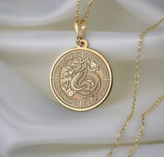 🐉 Step into the enchanting realm of Chinese New Year with our mesmerizing dragon necklace! 🎉 Crafted with meticulous attention to detail, this exquisite piece is a vibrant celebration of tradition, strength, and auspicious beginnings. Imagine the majestic dragon, intricately designed with shimmering scales ✨ and fierce claws, symbolizing power and resilience. With each wear, you'll embody the spirit of this mythical creature, carrying with you the energy of the Lunar New Year. 🌟 * Gender : Male / Female * Material Options : Silver, Gold Plated, Rose Gold, 14K Solid Gold * Thickness of Silver Pendant: 1.0 mm * Thickness of Gold Pendant: 0.8 mm * The Gold Plated and The Rose Gold Plated options are applied to 925 Sterling Silver with solution that contains 14K Gold. * There are several op Majestic Dragon, Mythical Dragons, Gold Dragon, Mythical Creature, Dragon Necklace, Dragon Pendant, Timeless Accessories, Small Pendant, Necklace Personalized