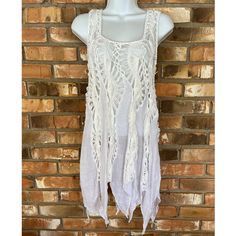 Vivid Importers Of Ny Women’s White Sleeveless Boho Crochet Swimsuit Coverup Or Top Available Sizes: Small, Medium And Large 65% Cotton 35% Polyester White Sleeveless Crochet Top For Festival, White Sleeveless Vest For The Beach, Sleeveless White Vest For The Beach, Fitted White Vest For Summer, Vacation Lace Trim Sleeveless Tank Top, Vacation Sleeveless Tank Top With Lace Trim, Sleeveless Summer Tank Top With Lace Trim, Summer Sleeveless Tank Top With Lace Trim, Cotton Lace Trim Tank Top For Beach