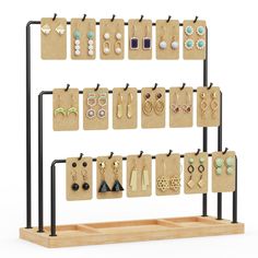 a display rack with earrings and earring hooks on wooden boards, isolated against a white background