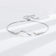 💎 Elevate Your Style with Sterling Silver: Choose the Silver-S925 option and experience the timeless beauty of the S925 Infinite Bracelet. Crafted from high-quality S925 sterling silver, this bracelet is not just jewelry; it's a symbol of everlasting connection and elegance. Adjustable Sterling Silver Bracelet, Adjustable Infinity Bracelet For Formal Occasions, Luxury Silver Infinity Jewelry, Silver Infinity Chain Bracelet As Gift, Silver Infinity Chain Bracelet Gift, Adjustable Silver Chain Bracelet Fine Jewelry, Silver Chain Bracelet As Fine Jewelry Gift, Silver Infinity Diamond Bracelet For Formal Occasions, Timeless Cubic Zirconia Chain Bracelet Gift