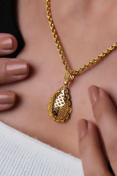 This flashy locket necklace with a drop pattern pendant is 22k solid gold. The necklace, which draws attention with its dimensions and weight, is a special jewel that you can use on the most special occasions. * Necklace weight: Approx. 8 grams * Pendant weight: Approx. 2,5 grams * Chain weight: Approx. 5,5 grams * There may be 10% -) deviation margin in the weight of the products. * Temiroglu Gold products are real solid gold. It is definitely not gold plated, not gold filled. * All products are presented to you in high quality jewelry boxes. * Depending on your request, we can provide delivery in the form of a gift package. Express Shipping Process    * United States: 4-6 business days    * Canada: 4-6 business days    * Australia: 4-6 business days    * UK: 4-6 business days    * Worldw Chain Lockets Gold For Women, Lockets Gold, 50th Birthday Gifts For Woman, Gold For Women, Drops Patterns, Birthday Gift For Women, Pendant With Chain, 50th Birthday Gifts, Gift Package