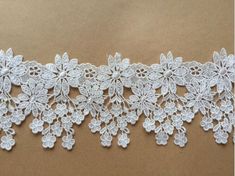 a white lace with flowers on it