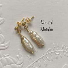 Sterling silver Biwa Pearl earrings featuring gorgeous natural metallic freshwater cultured Biwa pearls and yellow gold plated 925 sterling silver post and butterfly findings. A very simple but eye catching design! Pearls are June's birthstone making them an ideal birthday gift for June babies, wonderful for Brides or Bridesmaids or just for every day of the week. If you would like the earrings with yellow gold plated 925 sterling silver shepherd hook ear wires instead of the post and butterfly Gold Delicate Hypoallergenic Pearl Earrings, Dainty Handmade Gold Pearl Earrings, Pear-shaped High Luster Pearl Earrings Gift, Pear-shaped High Luster Pearl Earrings, Gold Dangle Pearl Earrings With High Luster, Gold Drop Pearl Earrings For Gift, Gold High Luster Dangle Pearl Earrings, High Luster Gold Dangle Pearl Earrings, Gold Dangle Pearl Earrings As Gift