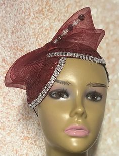 Burgundy and Wine Sinamay Fascinator Hat accented with burgundy sinamay and crinoline bows. Perfect for church, weddings, funerals and special occasions. Unique design accented rhinestones, bows and hat pin. Hat pin may vary. Hat measures approximately 9.5x5 inches. The hat affixes to the head by a hat elastic. Love what you see, but would like it in a different color, shape or size? Please contact us by sending a message. We offer custom hats in a variety of styles. PLEASE NOTE All items for Fr Kentucky Derby Party Hat With Satin Bow, Party Satin Bow Headband, Evening Headband With Satin Bow, Adjustable Satin Bow Headpiece For Party, Party Fitted Fascinator With Satin Bow, Adjustable Party Fascinator With Satin Bow, Formal Fitted Ribbon Fascinator, Adjustable Ribbon Headpieces For Parties, Formal Headband With Satin Bow