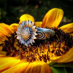 The original sunflower ring on Etsy! If sunflowers, summer, or a bohemian style is your your jam, then this is the ring for you. The flower is 17mm and perfect for sunflower weddings, bridesmaids gifts, birthdays, or a special gift to brighten your own day. They are my most popular ring and sell out quickly. The heavy sterling silver band has a lovely unique floral and spiral pattern. Each one will be slightly different given the nature of pattern and size of ring. After soldering the sunflower Vintage Adjustable Sunflower Design Jewelry, Bohemian Sunflower Design Jewelry As Gift, Bohemian Sunflower Jewelry As Gift, Summer Sunflower Design Jewelry, Bohemian Sunflower Jewelry For Gift, Bohemian Adjustable Flower Ring For Anniversary, Bohemian Flower Ring For Wedding, Bohemian Flower Ring As A Gift, Bohemian Flower Ring For Promise