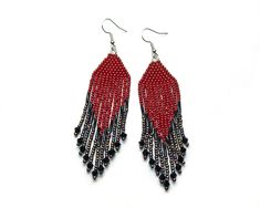 Bohemian Dangle Earrings For Evening, Party Beaded Fringe Earrings Adjustable, Evening Beaded Earrings With Round Beads, Adjustable Red Beaded Fringe Earrings, Red And Black Beaded Drop Earrings, Red Beaded Tassel Earrings For Party, Bohemian Evening Jewelry With Beads, Traditional Beaded Fringe Jewelry, Red Tassel Beaded Earrings