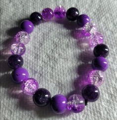 Purple and crystal bead bracelet Purple Crystal Beaded Bracelets As Gift, Purple Crystal Bracelets With Round Beads, Crystal Gemstone Beaded Bracelets, Crystal Bracelet With 8mm Beads For Jewelry Making, Purple Beaded Crystal Bracelet, Purple Crystal Bracelets, Crystal Beaded Charm Bracelet With Round Beads, Beaded Crystal Charm Bracelet With Round Beads, 8mm Crystal Bead Bracelet